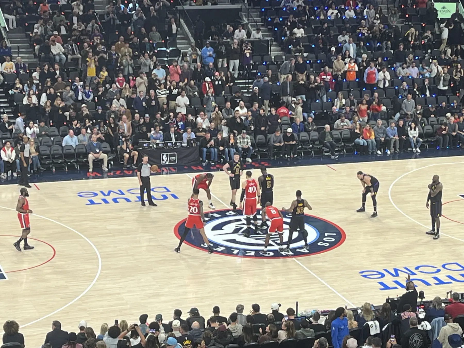 Professional basketball players preparing for tipoff