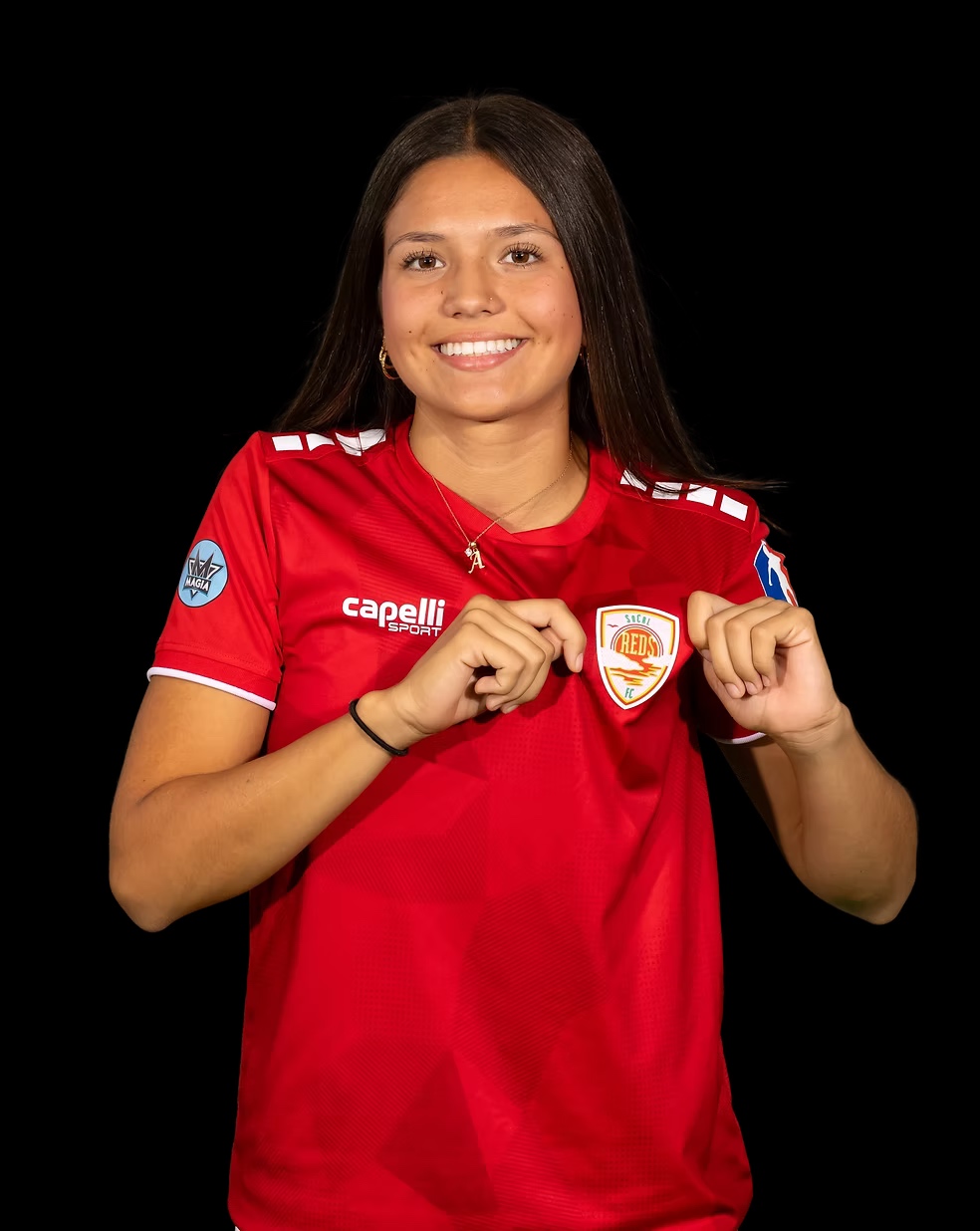 SoCal Reds player displaying club crest